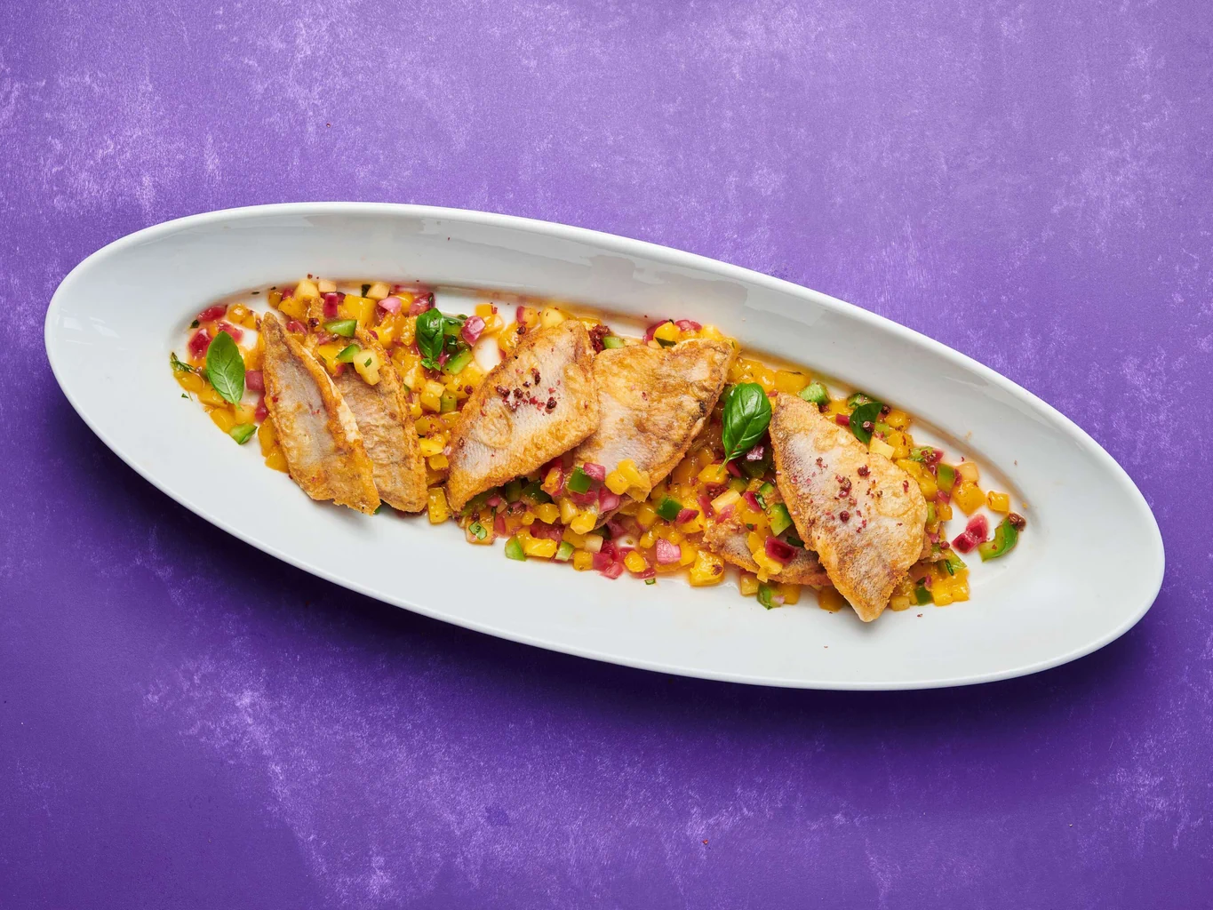 Filetti di pesce persico con salsa al mango