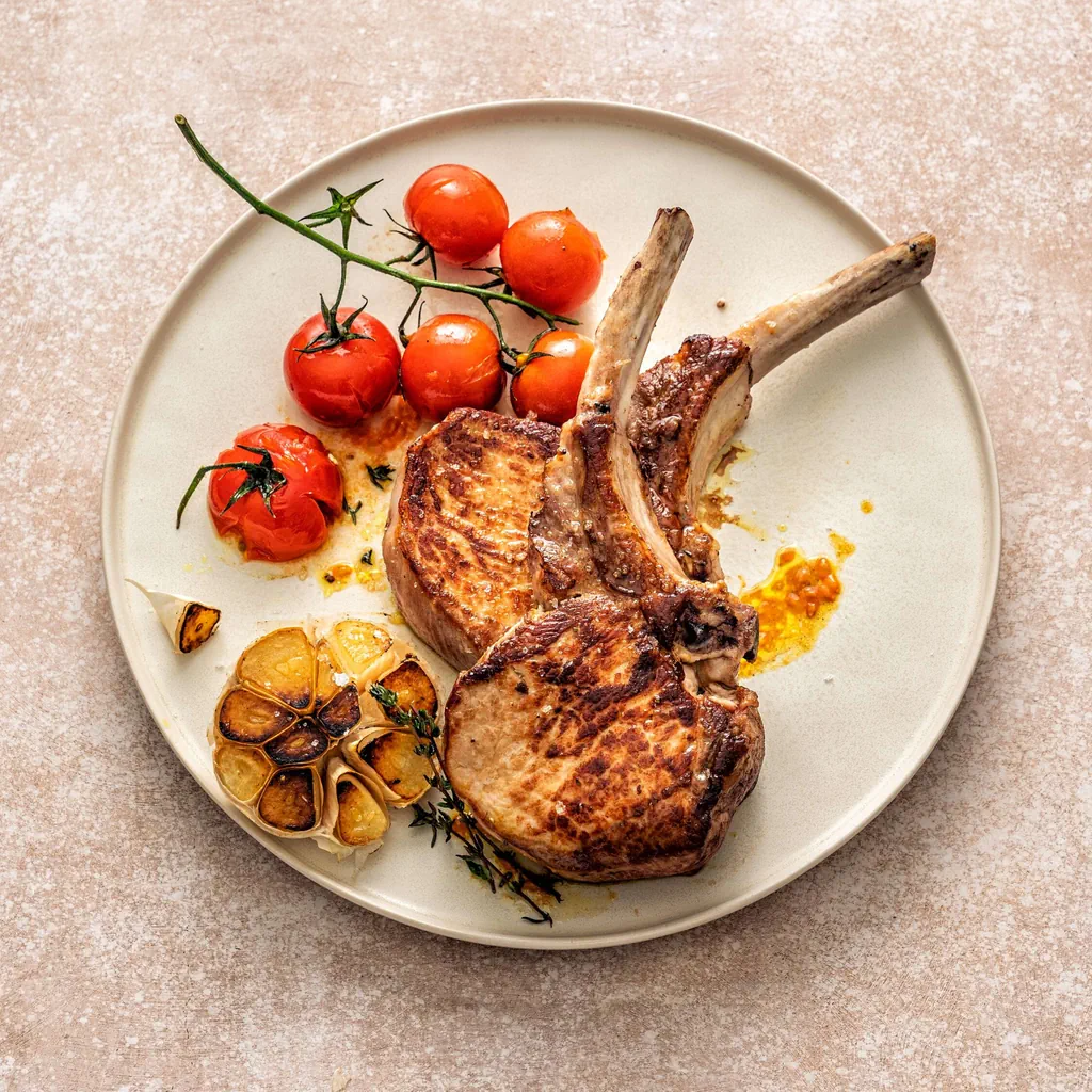 Schweinskotelett mit Curry-Tomaten