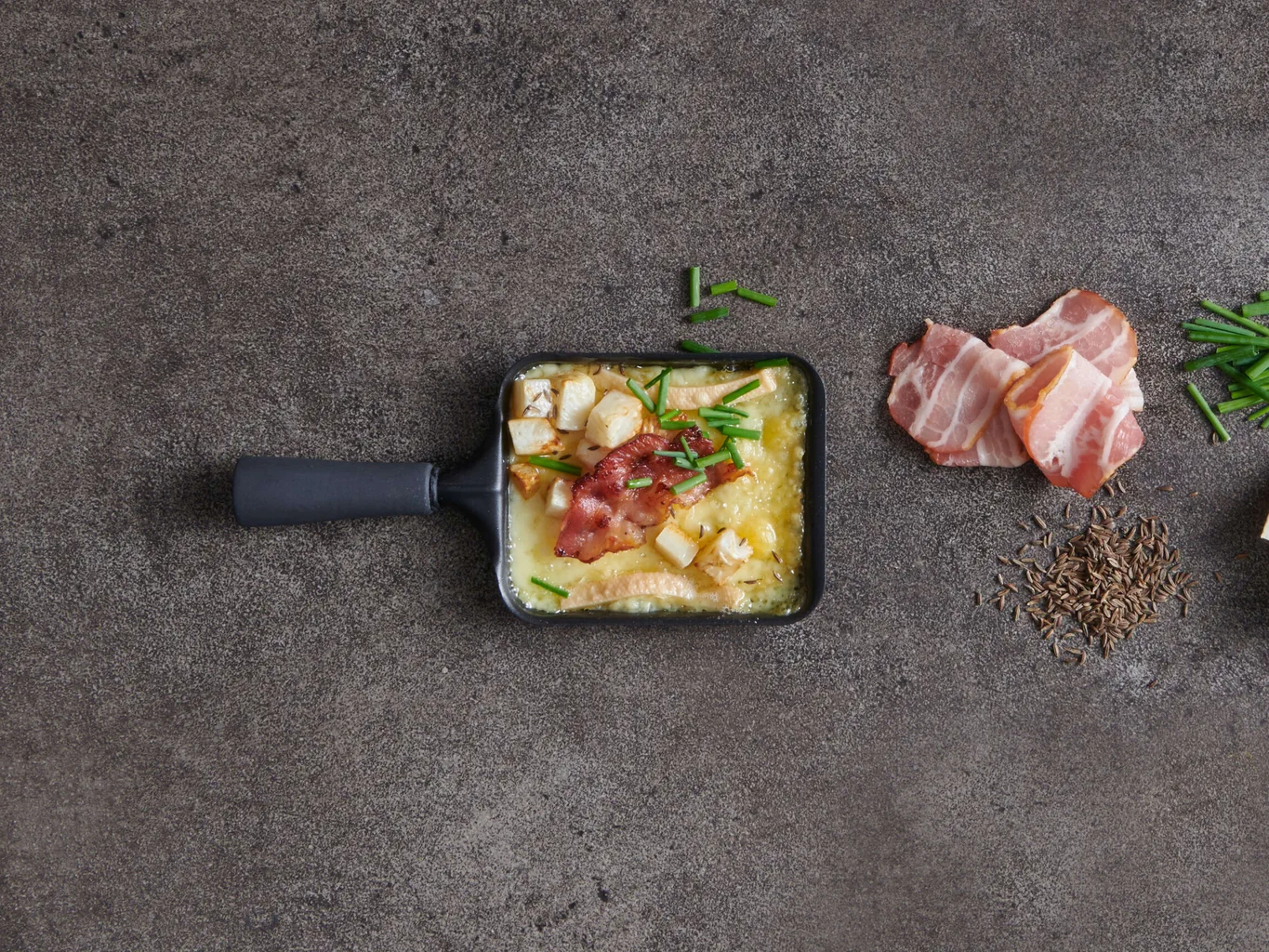 Raclette mit Speck-Sellerie-Topping