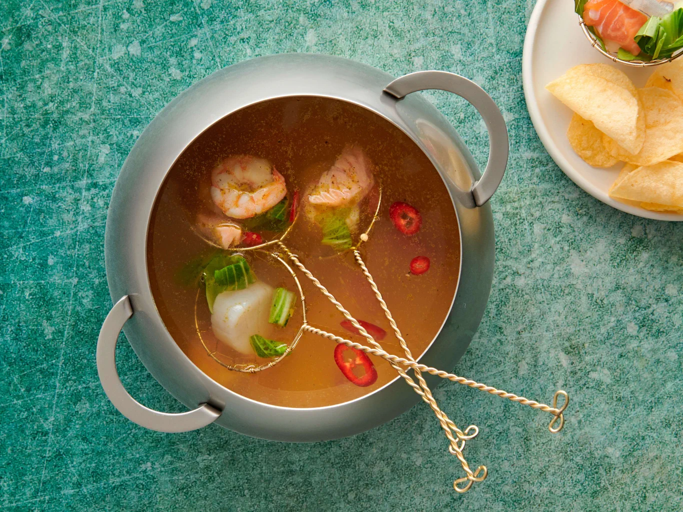 Fondue de poissons avec noix de Saint-Jacques et crevettes