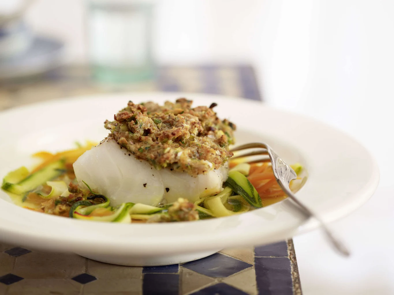 Fischfilet mit Pistazienkruste auf Gemüse