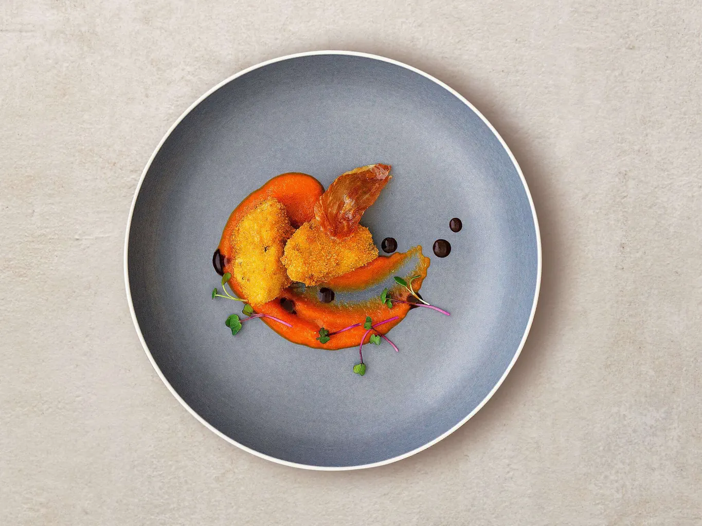 Artichauts panés sur crème de tomates