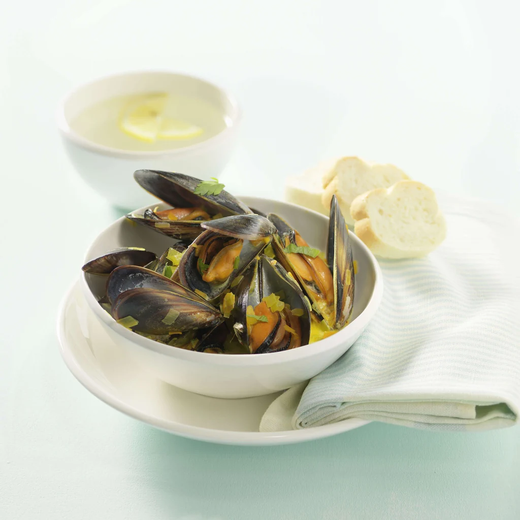 Moules à la sauce safran avec poireau et carottes