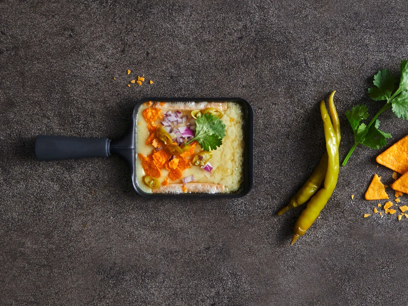 Raclette con topping di nachos