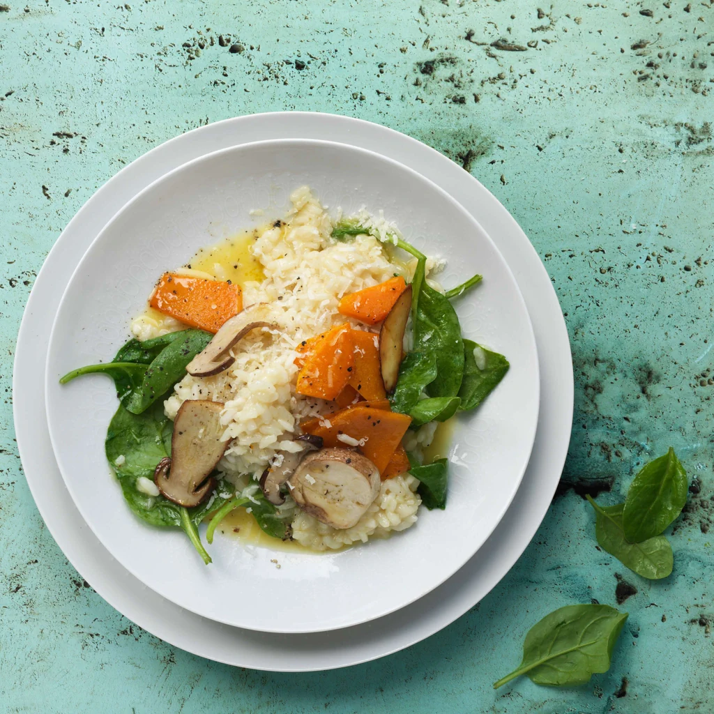 Risotto mit gebratenem Kürbis, Steinpilzen und Spinat